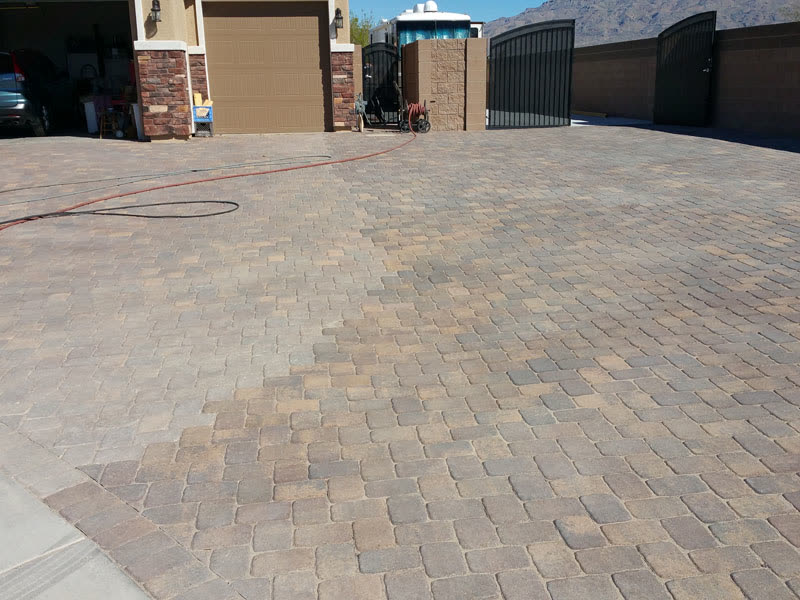 Driveway with a new section that doesn't match the old pavers