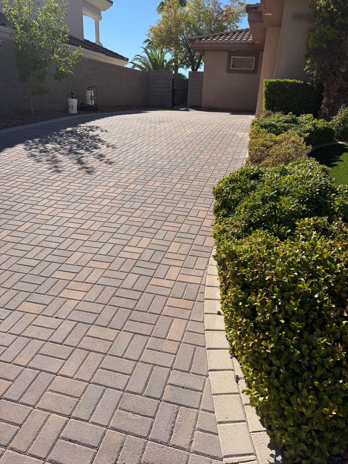 Sealed paver driveway at a custom home