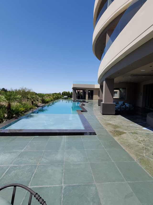 Slate pool deck at a modern estate