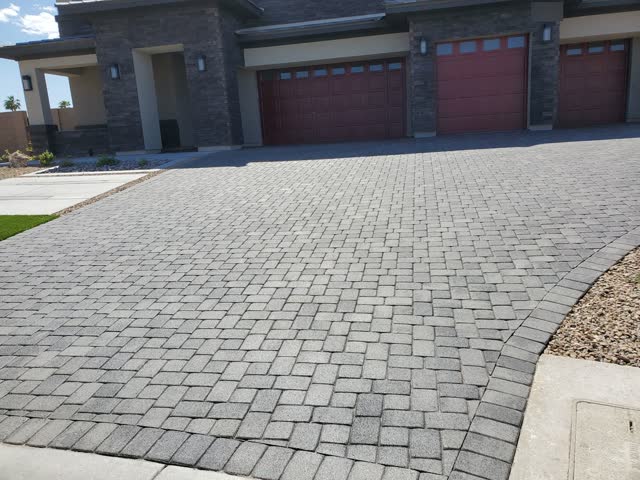 Charcoal paver driveway at a modern home