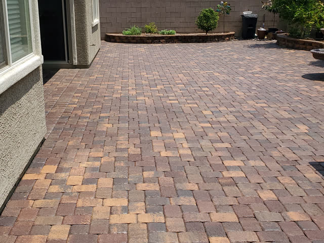 Large sealed paver back patio