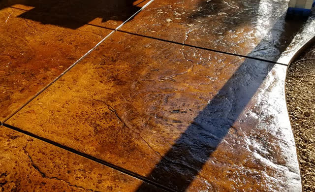 Freshly stained and sealed stamped concrete
