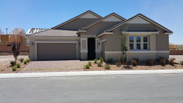 New home with a freshly sealed driveway