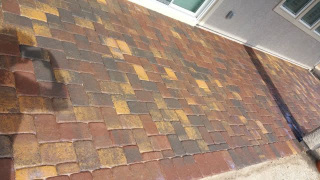 Paver patio just after sealer is sprayed