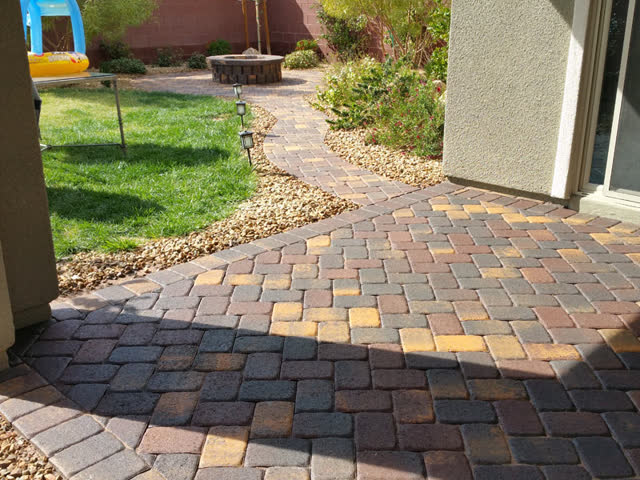 Sealed paver patio and path to a fire pit