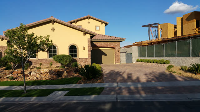 Sealed driveway at a Mediterranean-style home