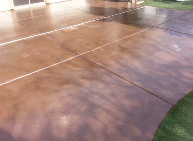 Concrete patio with a rich brown stain