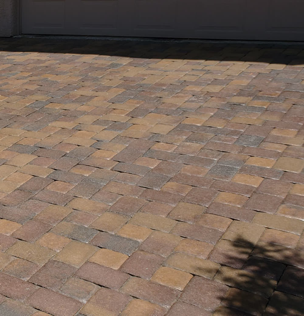 The same pool deck after sealing, with richer color