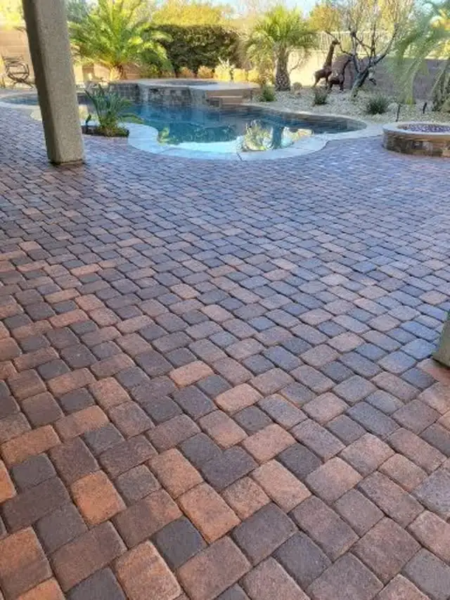 Paver pool deck with a spa