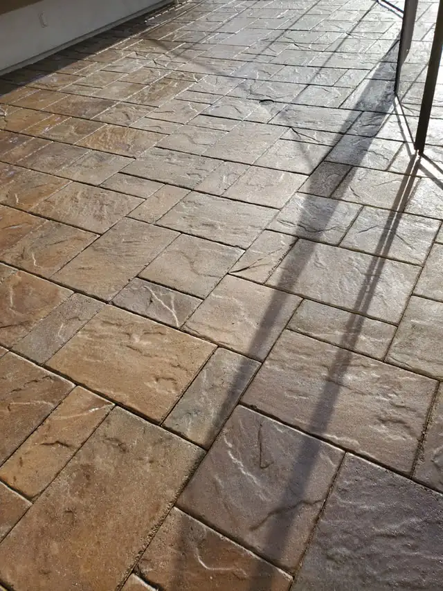 Textured slab pavers under a covered patio
