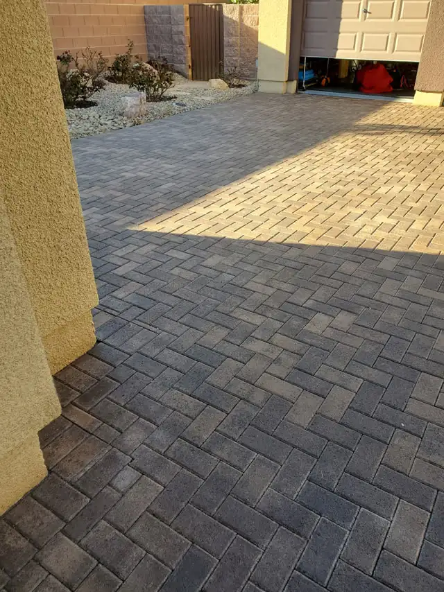 Herringbone paver driveway in charcoal and tan