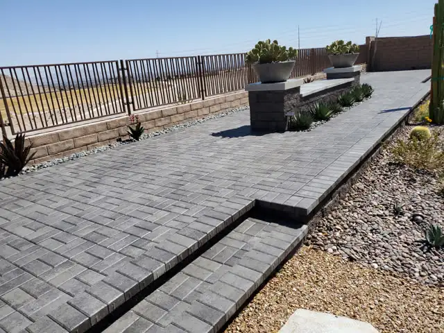 Gray paver terrace with steps and planters