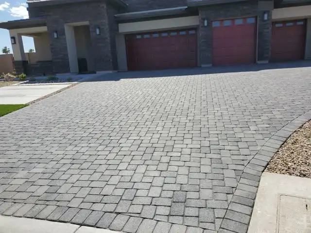 Charcoal paver driveway at a modern home