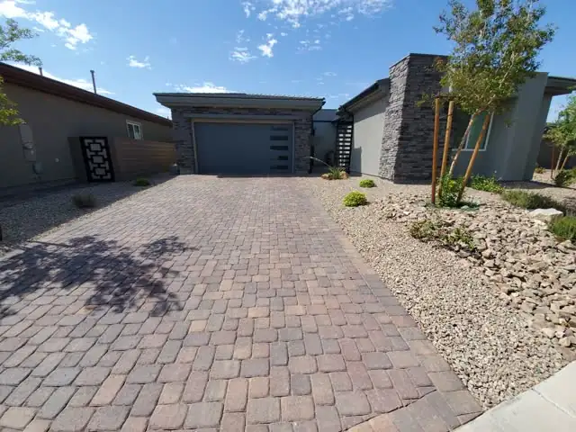 Paver driveway at a modern single-story home