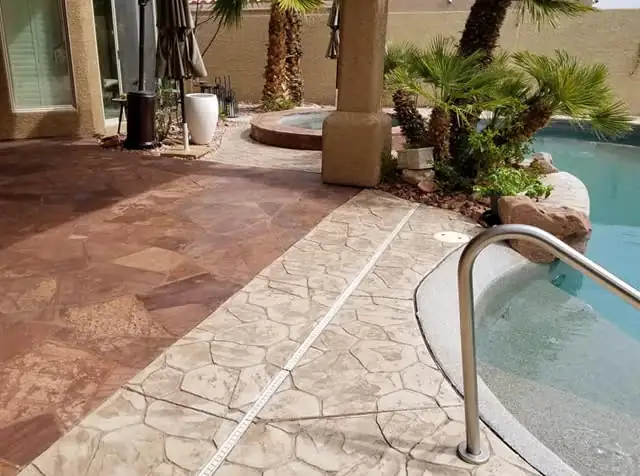 Stamped concrete and flagstone pool deck, sealed