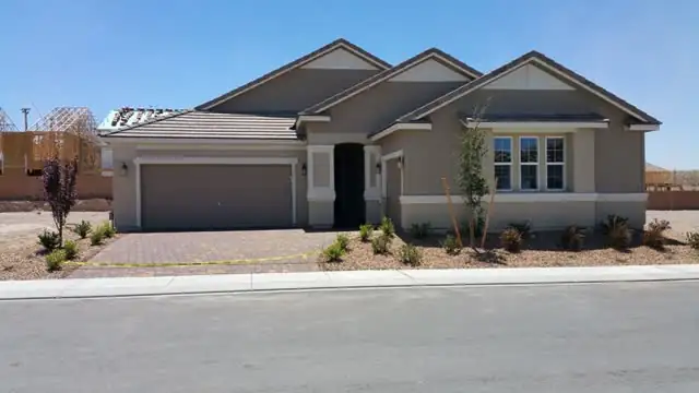 New home with a freshly sealed driveway