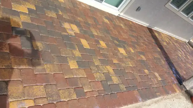Paver patio just after sealer is sprayed