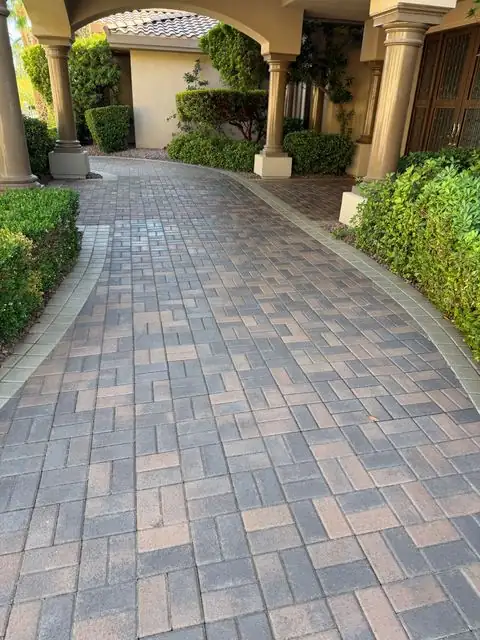 Sealed paver entry under stone arches