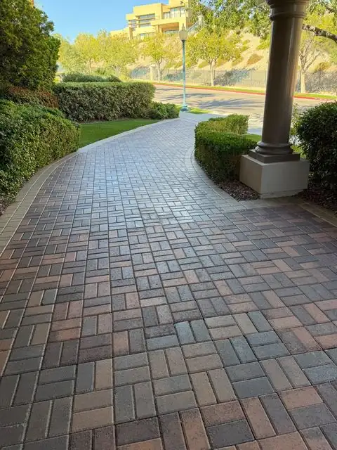 Sealed paver walkway past the front columns